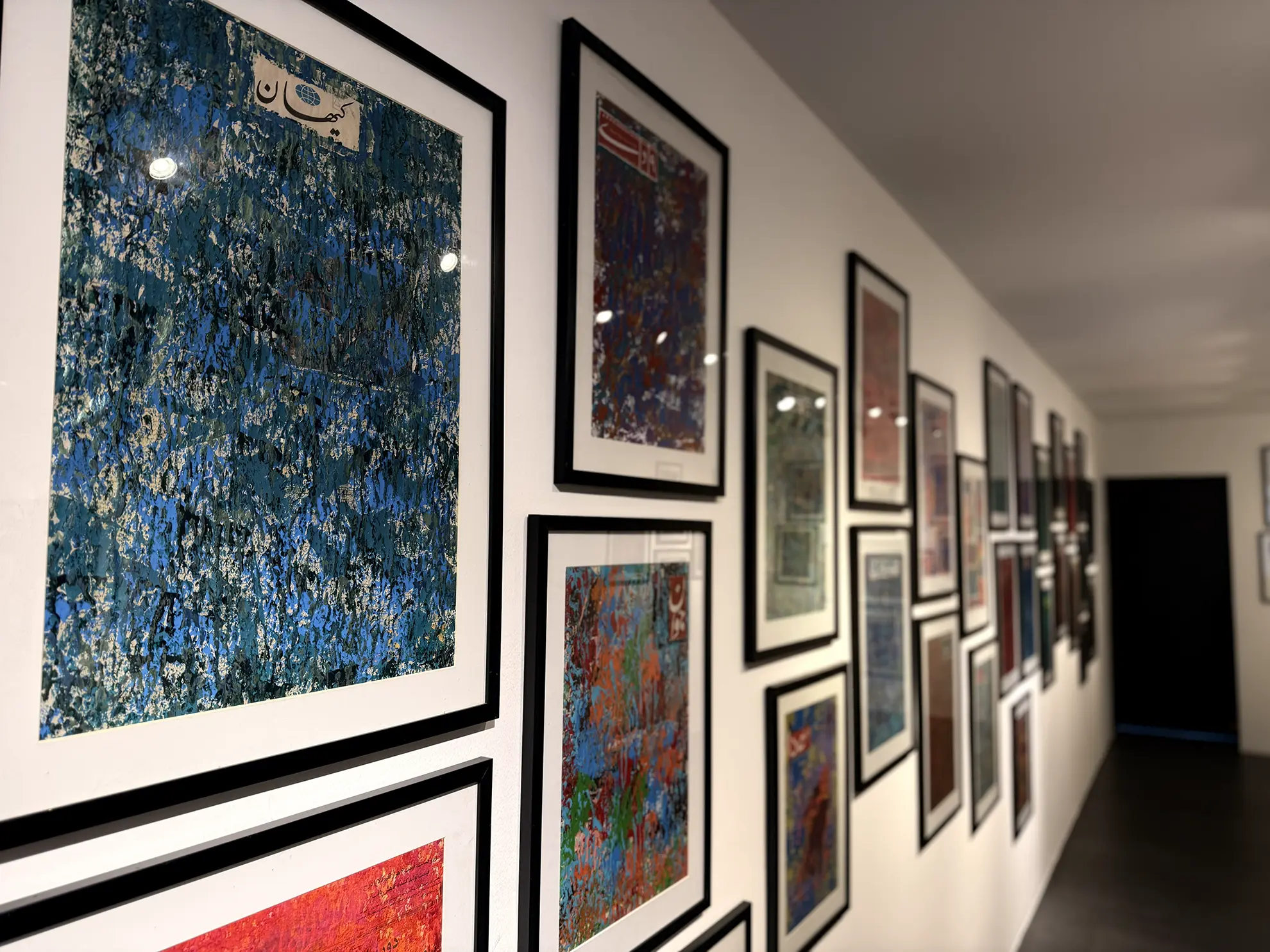 A curated gallery installation of framed works at Matin Curatorial House